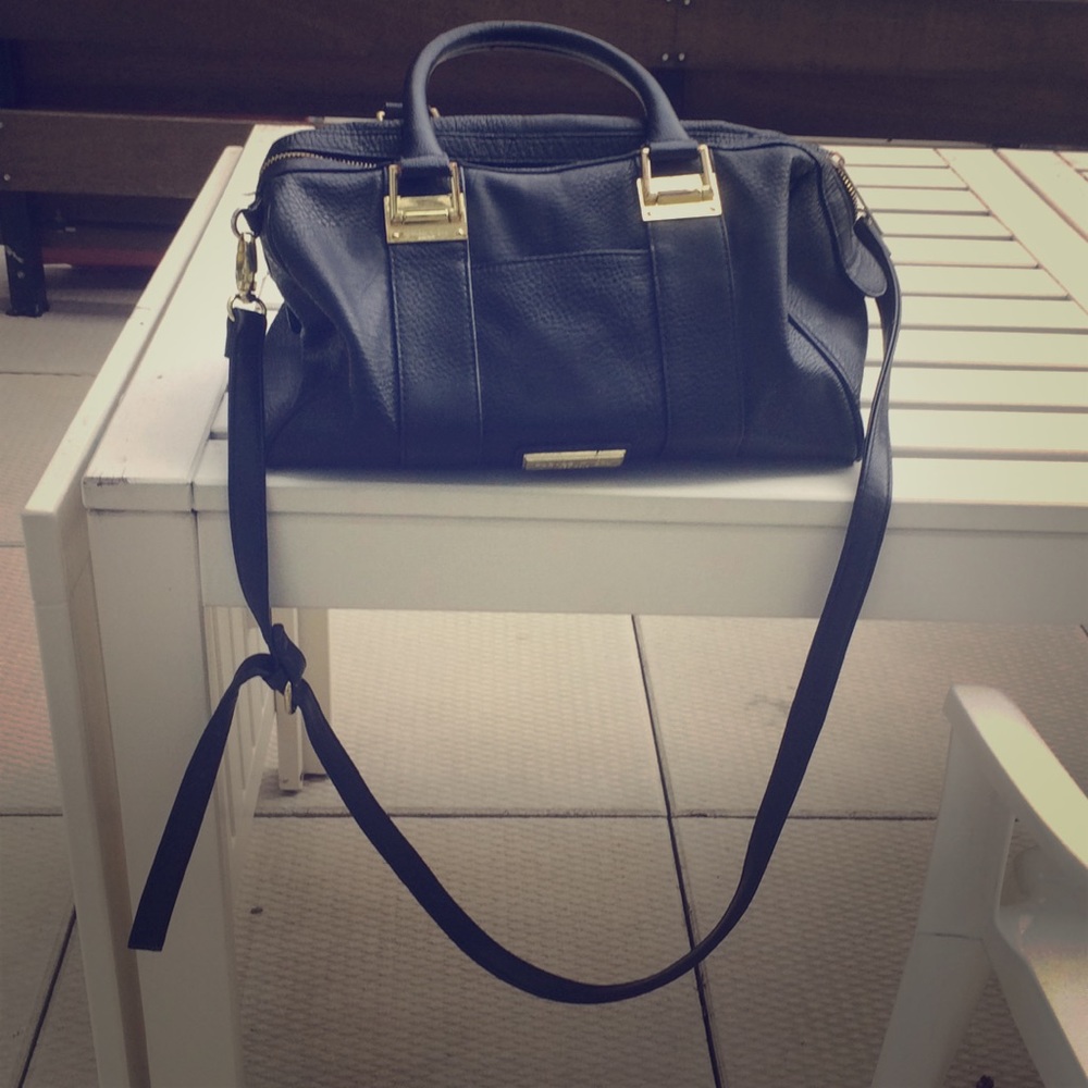 Black and gold cross body bag. Olivia + joy editor