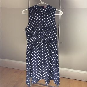 Navy blue polka dotted high neck open back dress