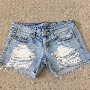 Light overly distressed denim shorts