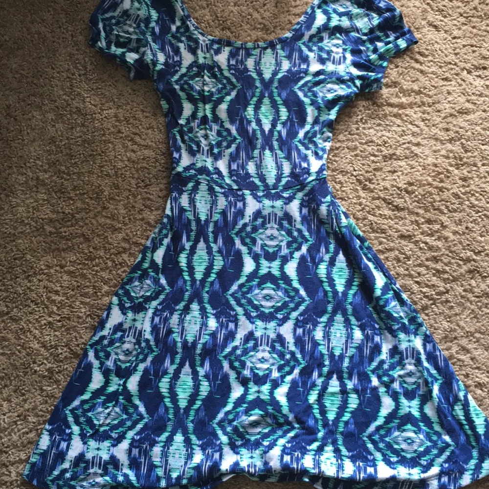 A knee length open back spandex dress
