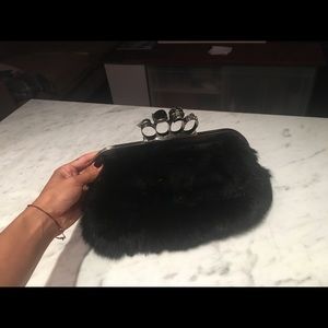 Rabbit fur clutch with skull knuckles handle