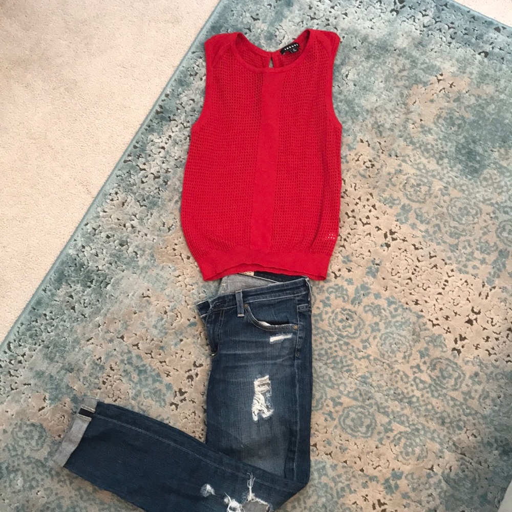 Sleeveless sweater top with sexy mesh openings.