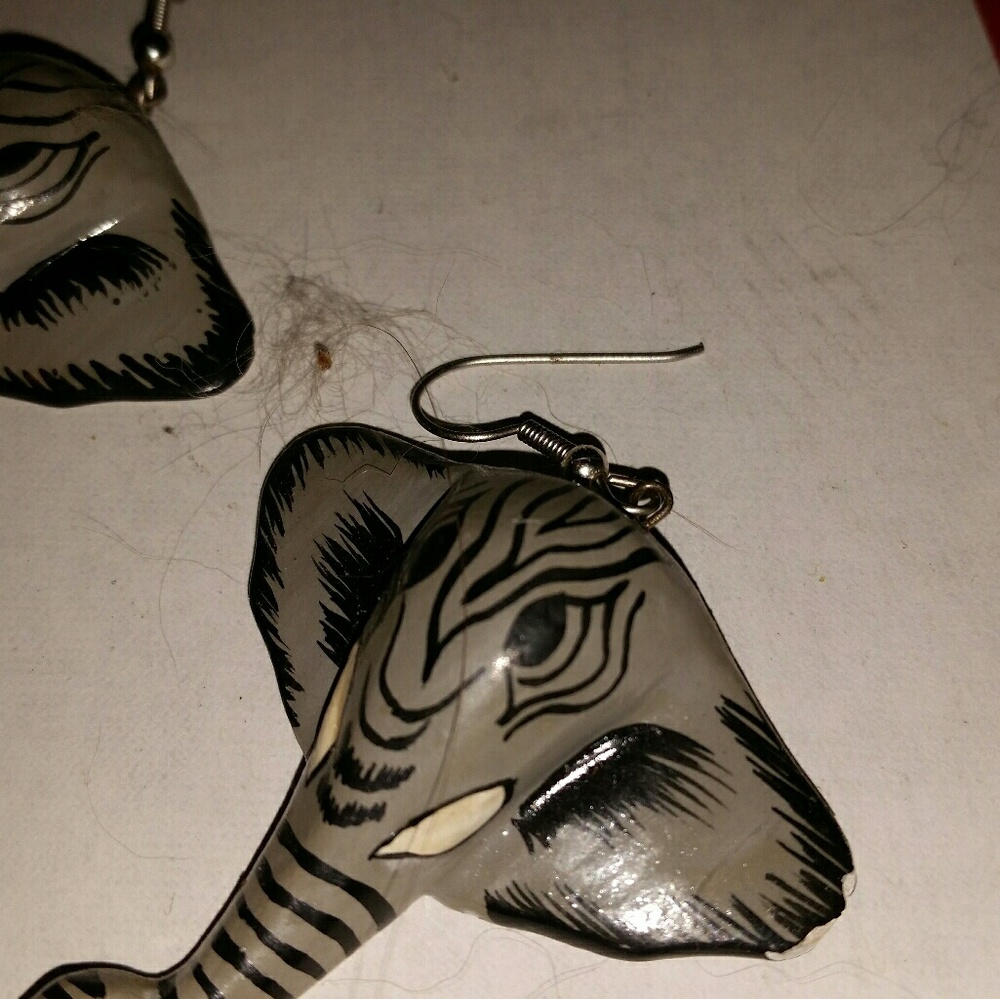 Hand crafted; carved and painted wood elephant ear