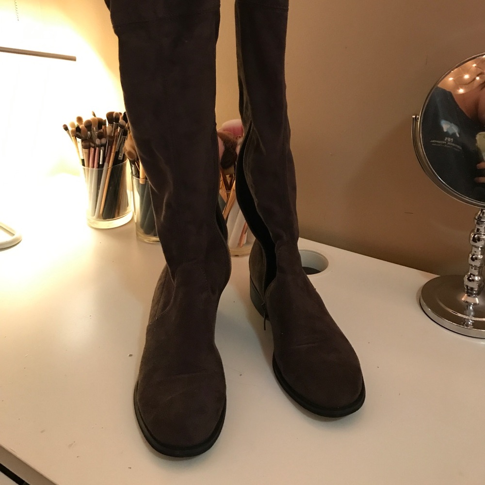 Tall brown thigh high boots