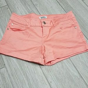 Peach pink or salmon shorts