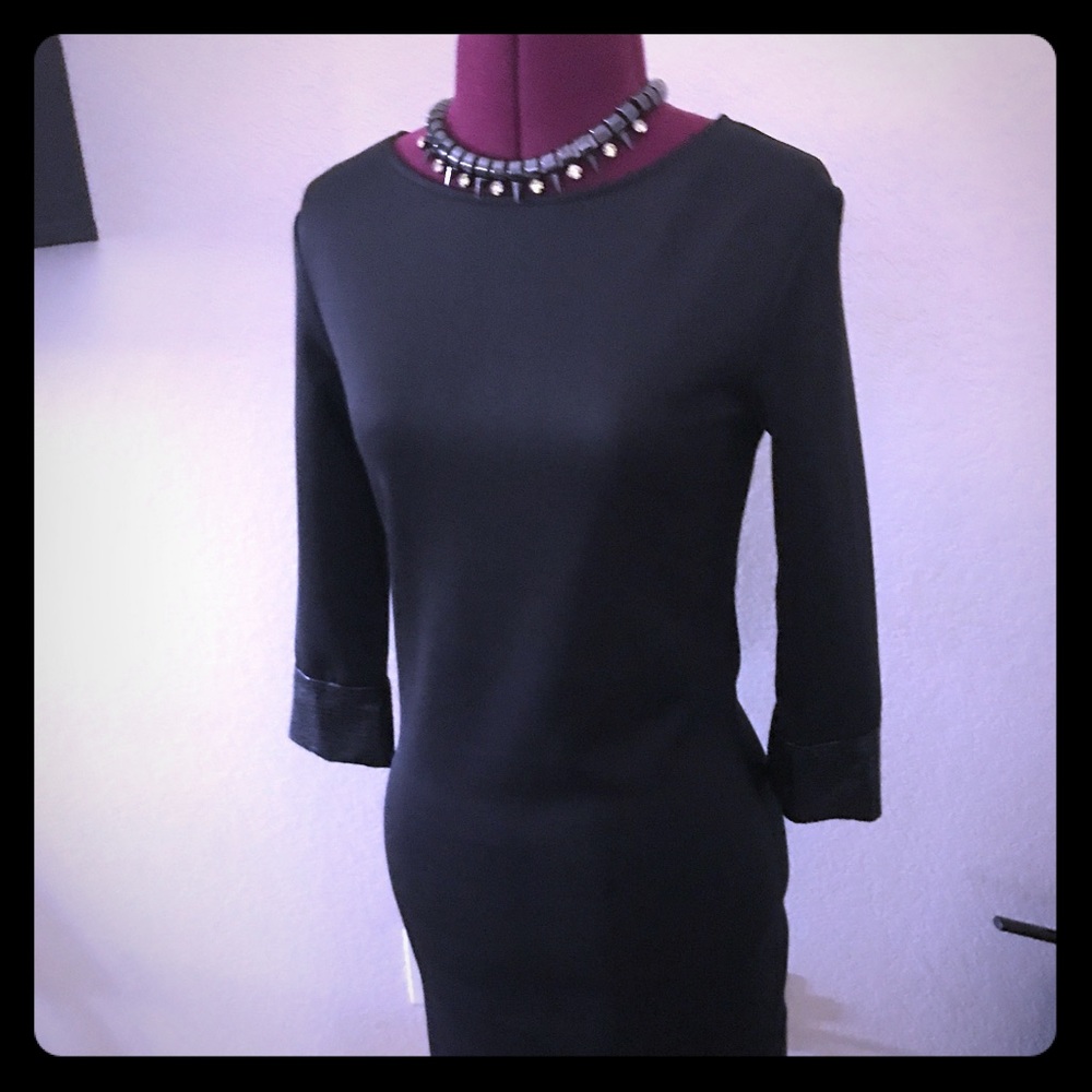 Brand new black dress with black faux snake cuffs
