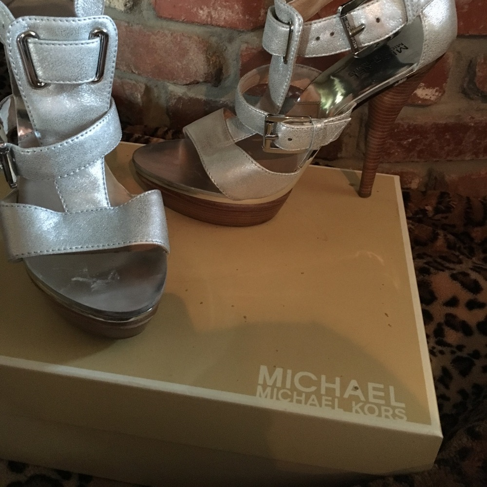 Michael Kors silver platforms. 5 1/2 inches