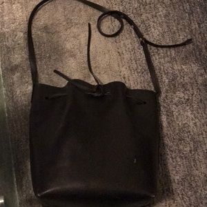 Mansur Gavriel black bucket tote with red interior