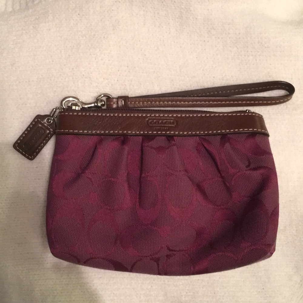 Coach clutch with strap