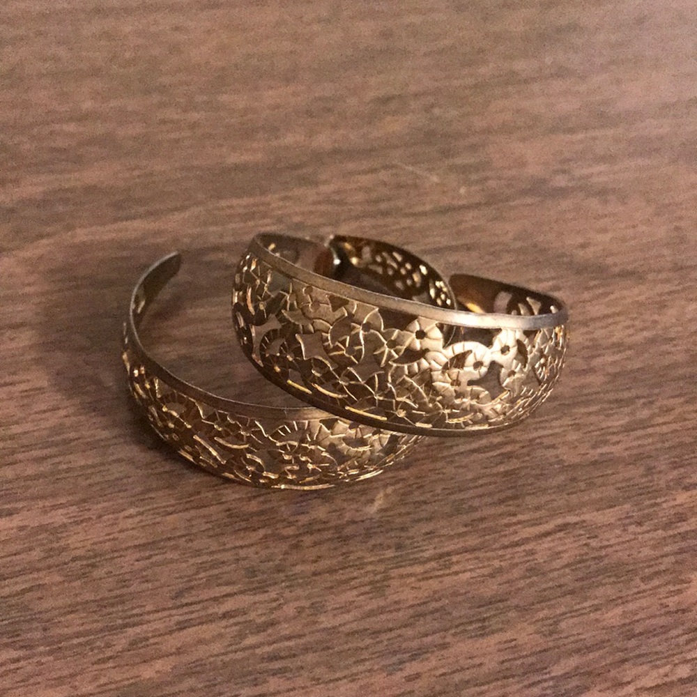 Gold hoop earrings with cut out pattern