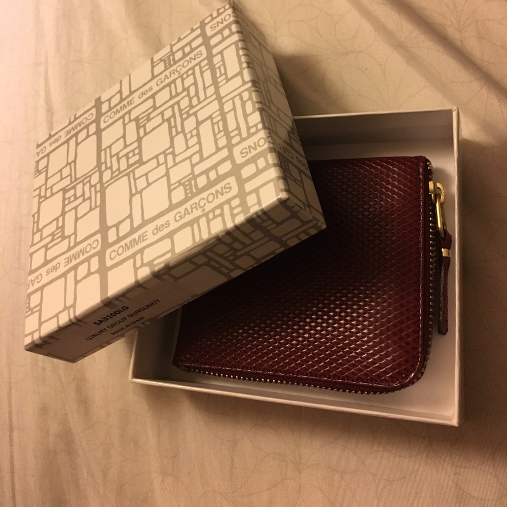 Comme des Garçons burgundy zip wallet FIRM PRICE.