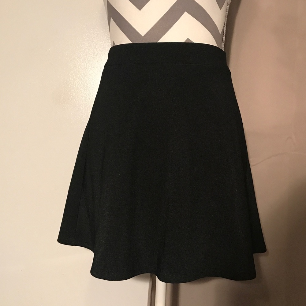 Small black high waisted mini skirt