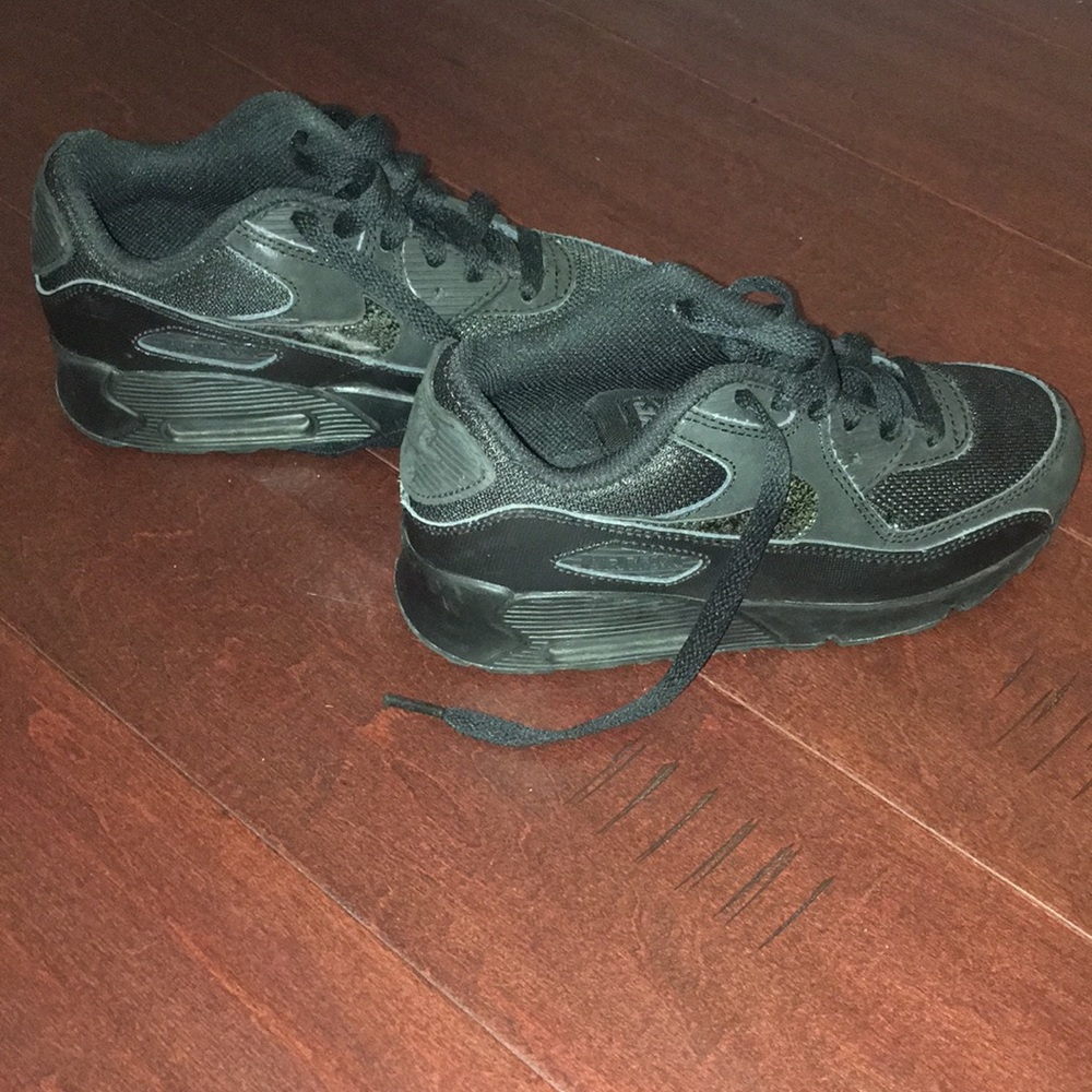 Kids black low top Nike Air Max sneakers