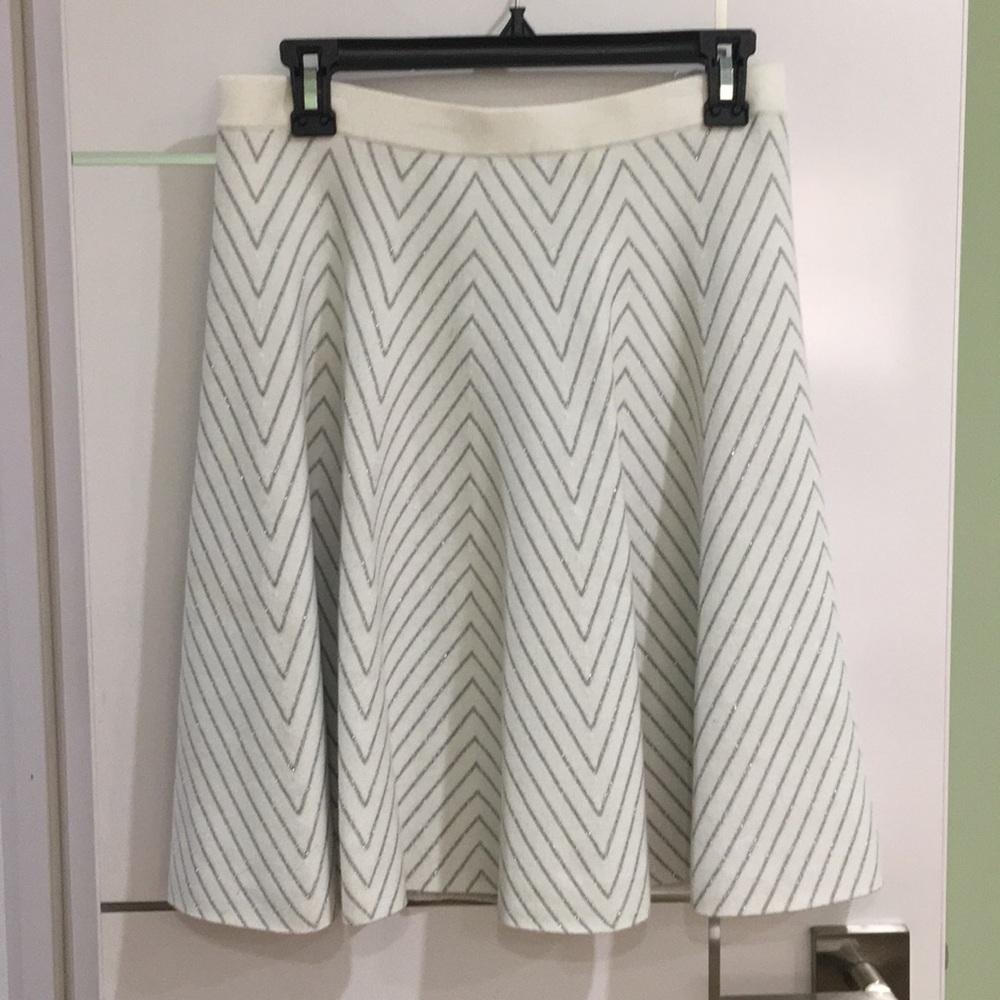 White and silver skirt.