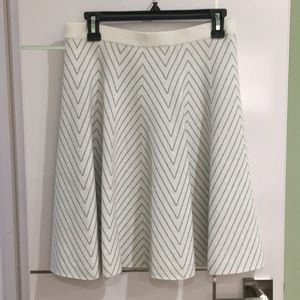 White and silver skirt.