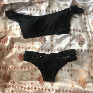 Off-the-shoulder black bikini with cut-out detail