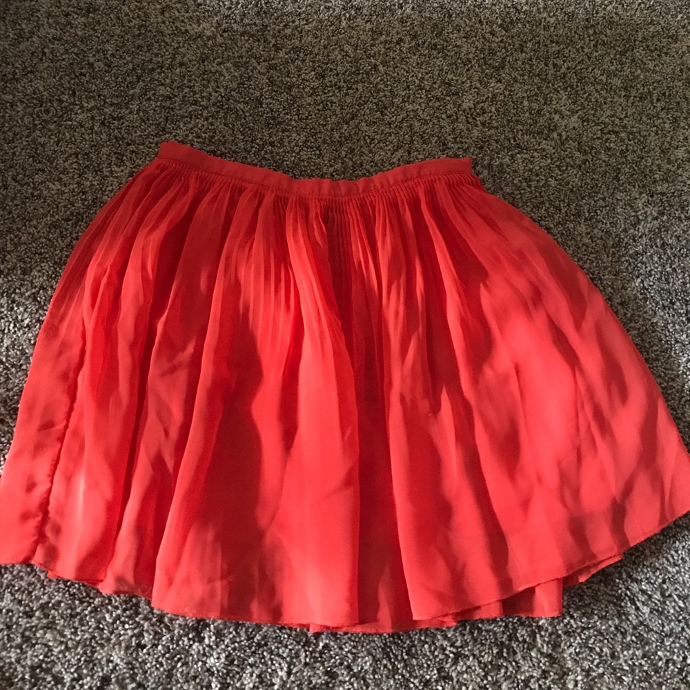 Orange pleated skirt