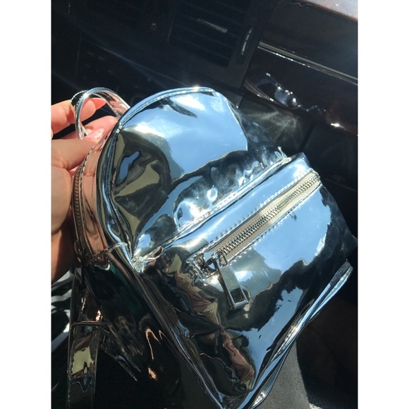 Metallic Handbags - Miniature metallic backpack✨ NWT