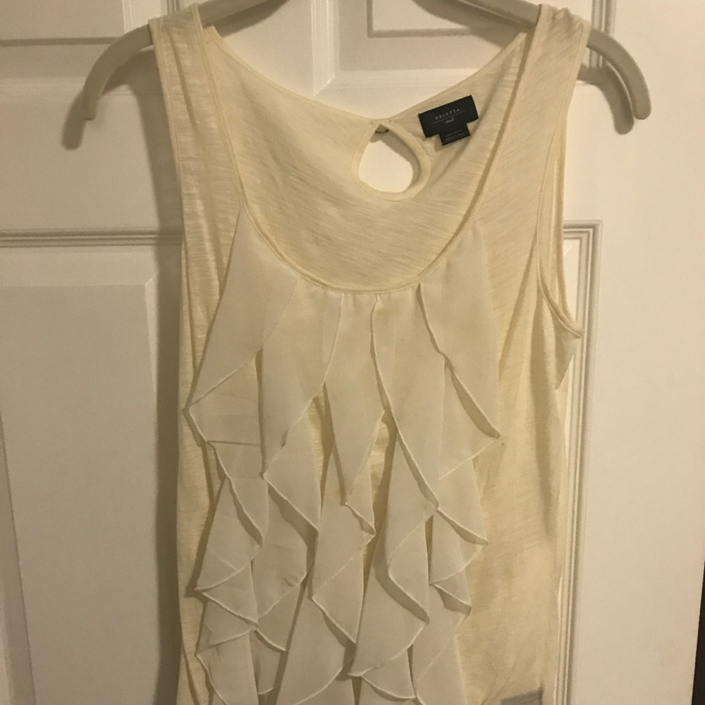 Tan top, ruffles. Gently used