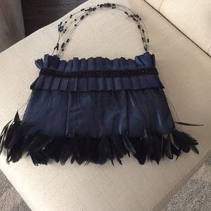Evening bag with bead and feather details