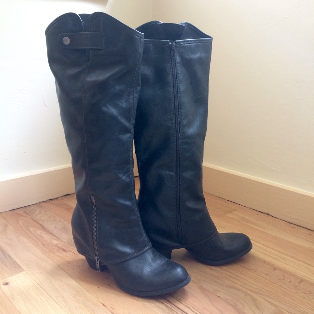 Black zip boots. Below the knee.