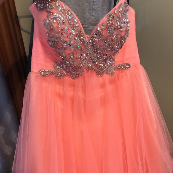 A orange strapless homecoming dress. - Picture 1 of 2