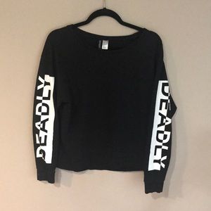 Sweater with "deadly" on the sleeves