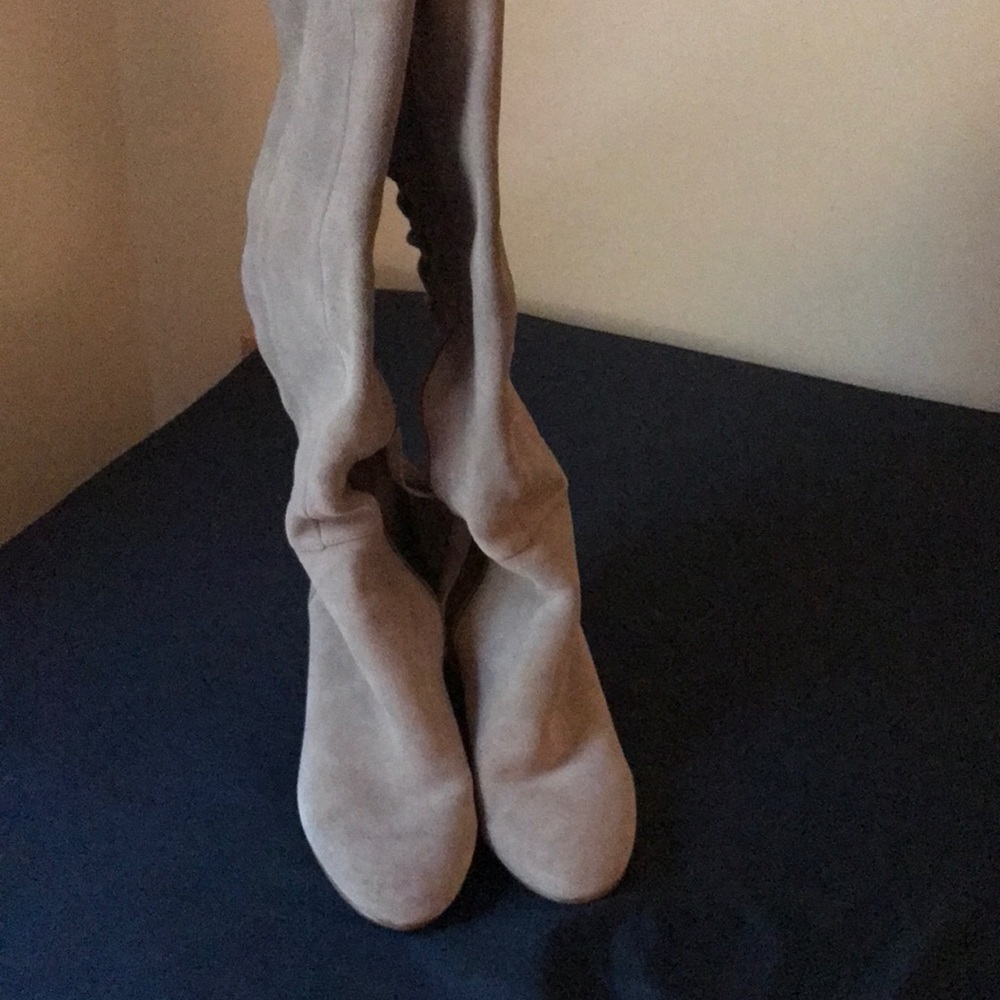 Knee high boots with lace up back.