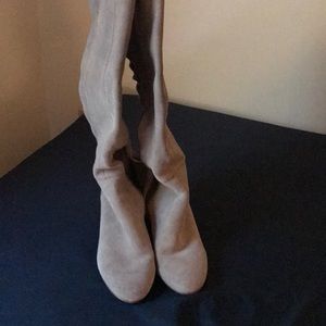 Knee high boots with lace up back.