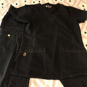 Four stretch scrubs top is S and bottoms are M