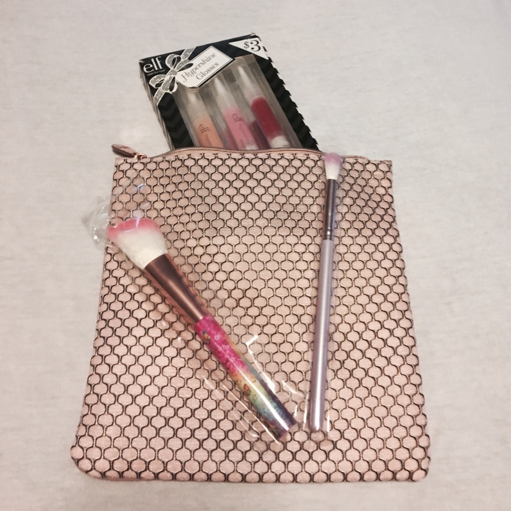 Make up blending brushes. 3 lipgloss. Makeup bag.