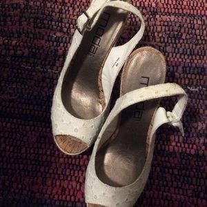 White lace eyelet sling back open toe shoes.