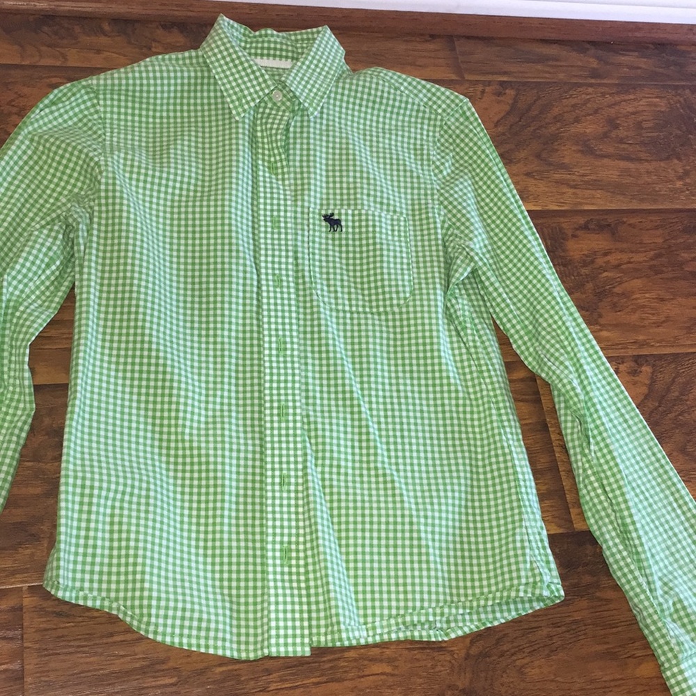 A green and white long sleeve