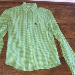 A green and white long sleeve