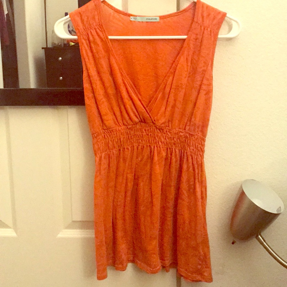 Maurice's orange blouse