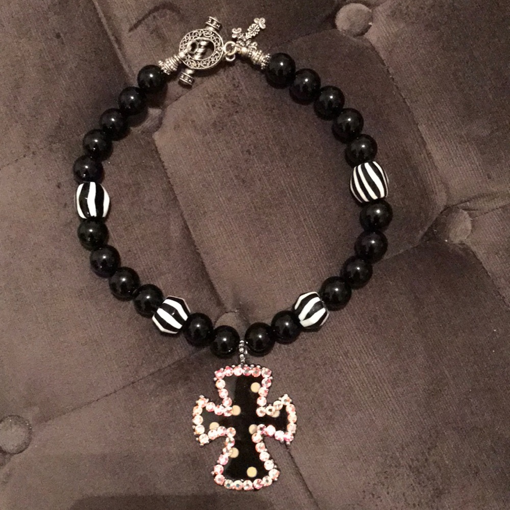 These are custom made so necklaces vary as far as where polka dots are