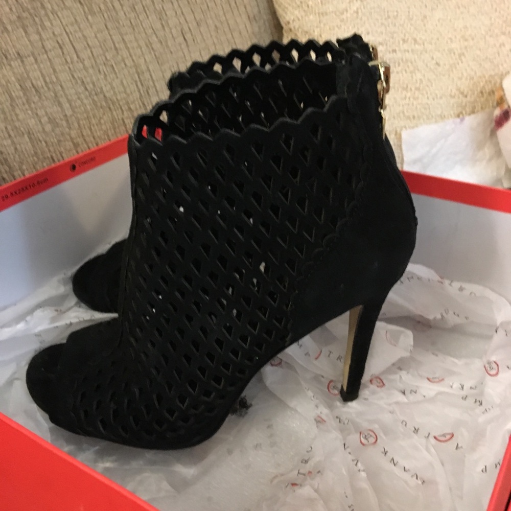 Caged black booties with zip back