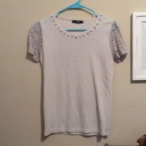 White top with floral lace mesh sleeve and pearls