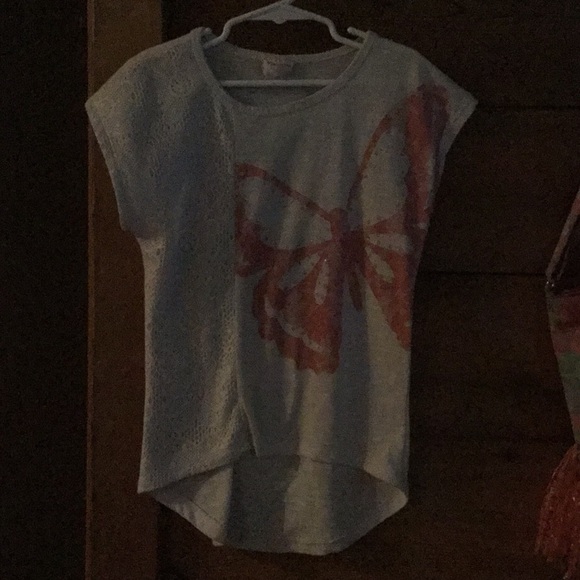 An off white t-shirt with butterfly on it. - Picture 1 of 3