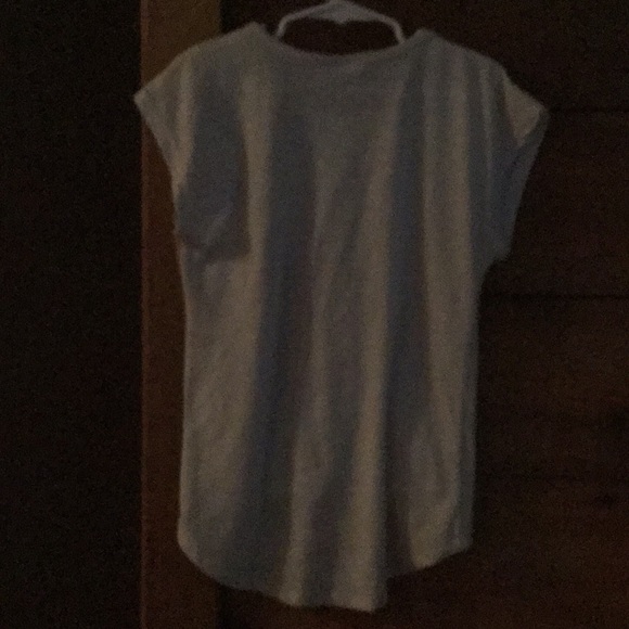 An off white t-shirt with butterfly on it. - Picture 2 of 3