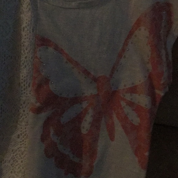 An off white t-shirt with butterfly on it. - Picture 3 of 3