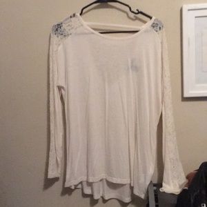 See-through white shirt with floral lace sleeves