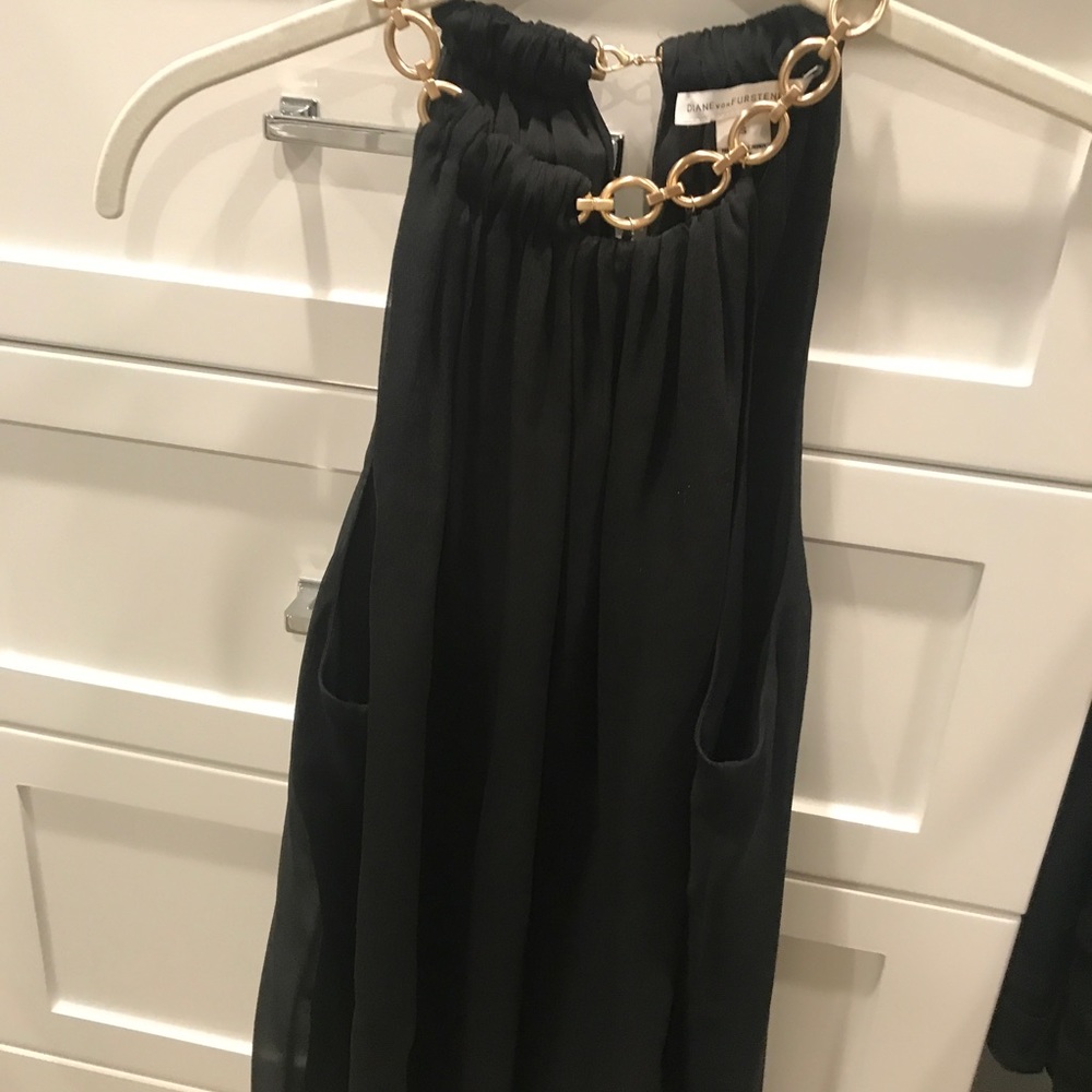 Sexy black top with gold chain necklace attached.