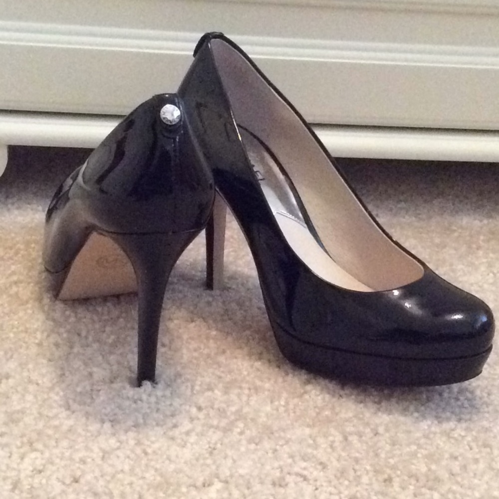 Michael Kors black patent platform pumps
