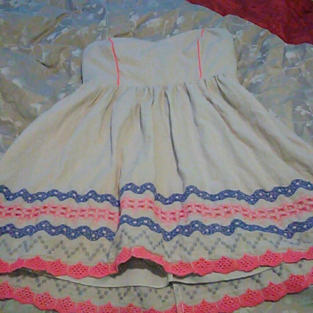 A pink, cream, blue, amd silver midi dress