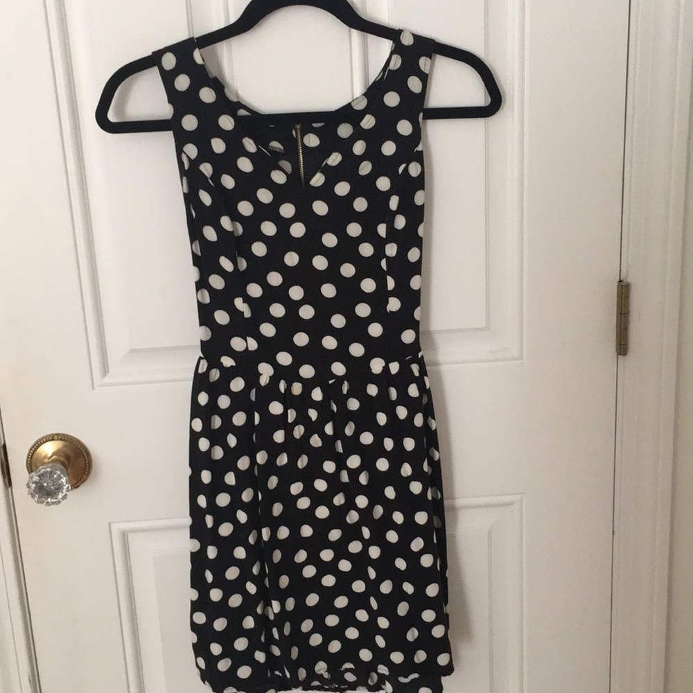 Black and white polka dot sleeveless dress