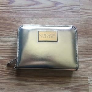 Versace gold wristlet