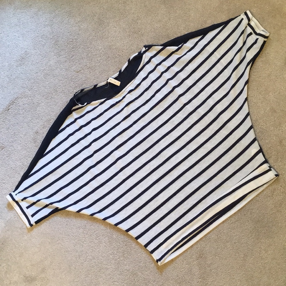 Cute top with sheer back and red button detail