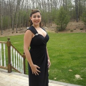 Long, navy blue formal dress with jeweled accents