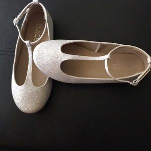 Place silver girls shoes